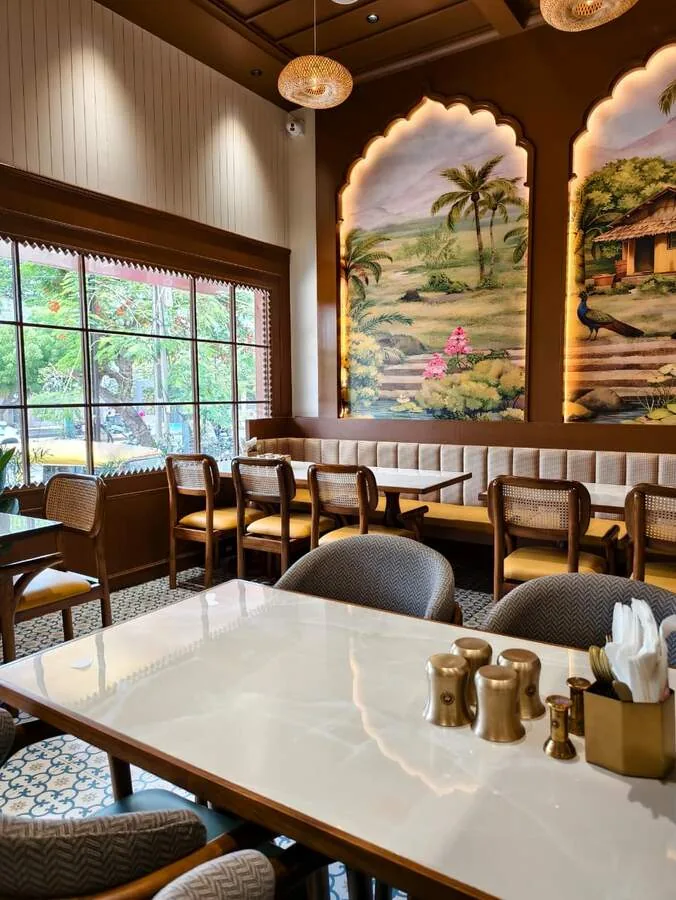 South Masala dining room with handcrafted arches and South Indian murals